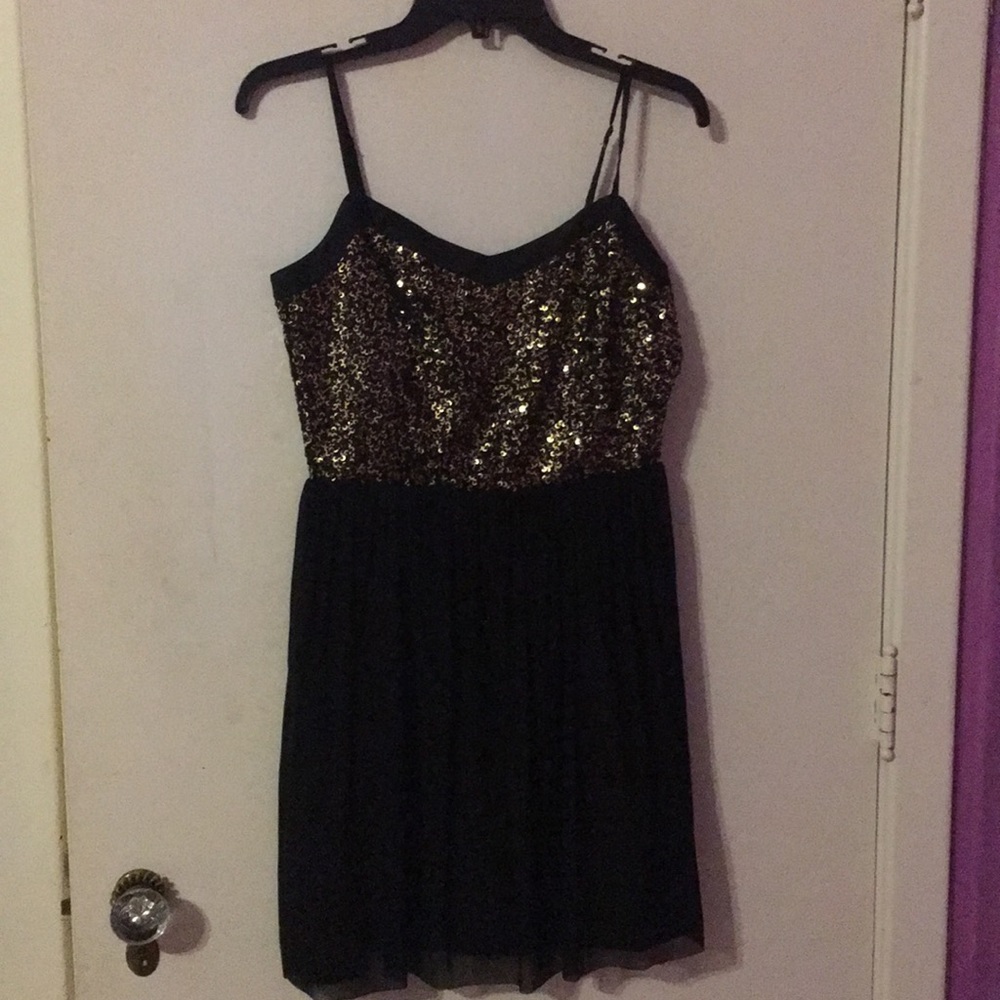 Black and gold sequin dress